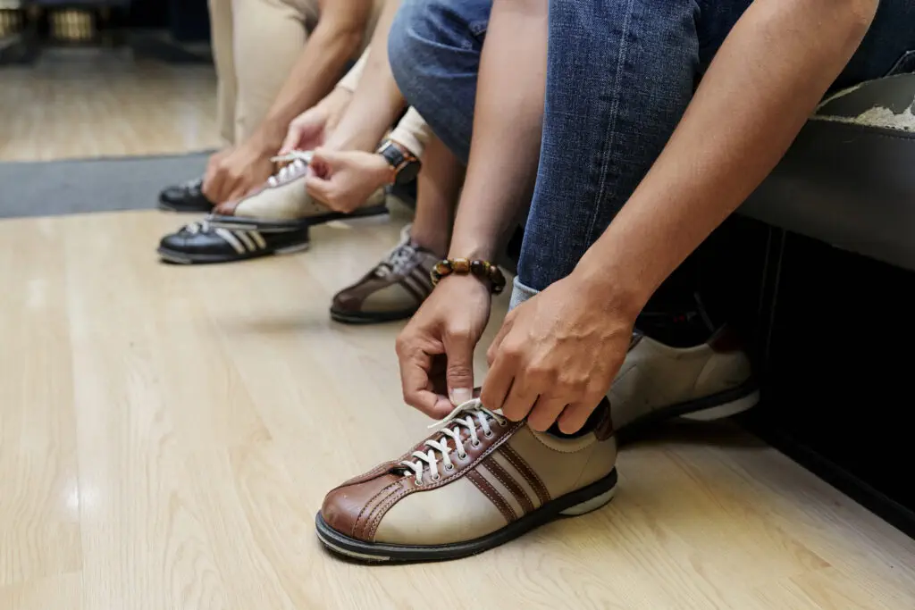People wearing bowling shoe rental