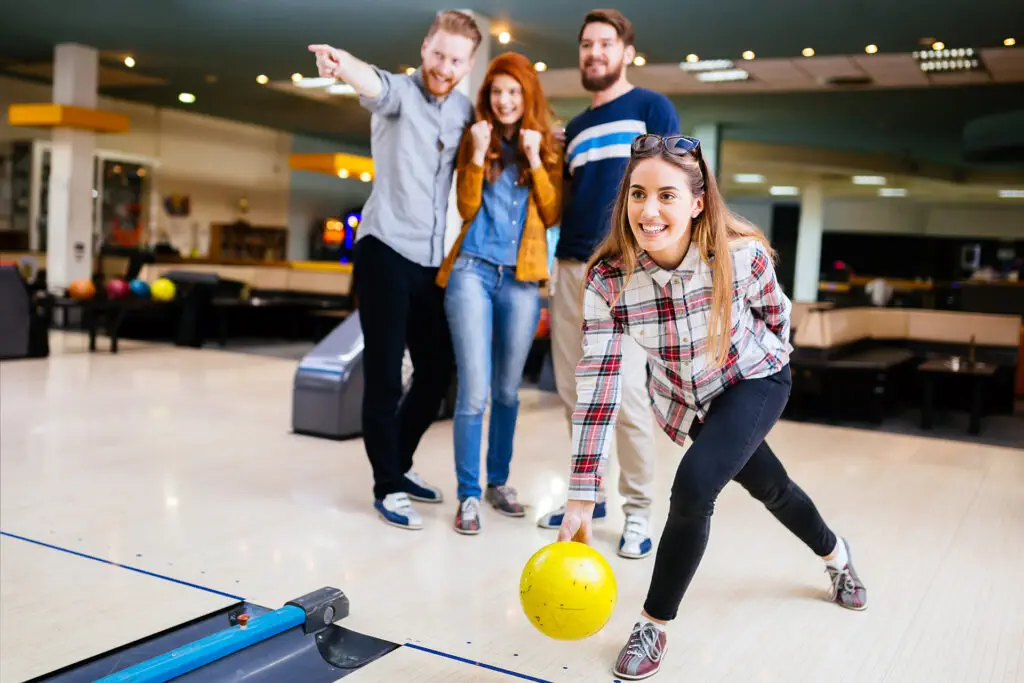 Competitve people enjoying bowling